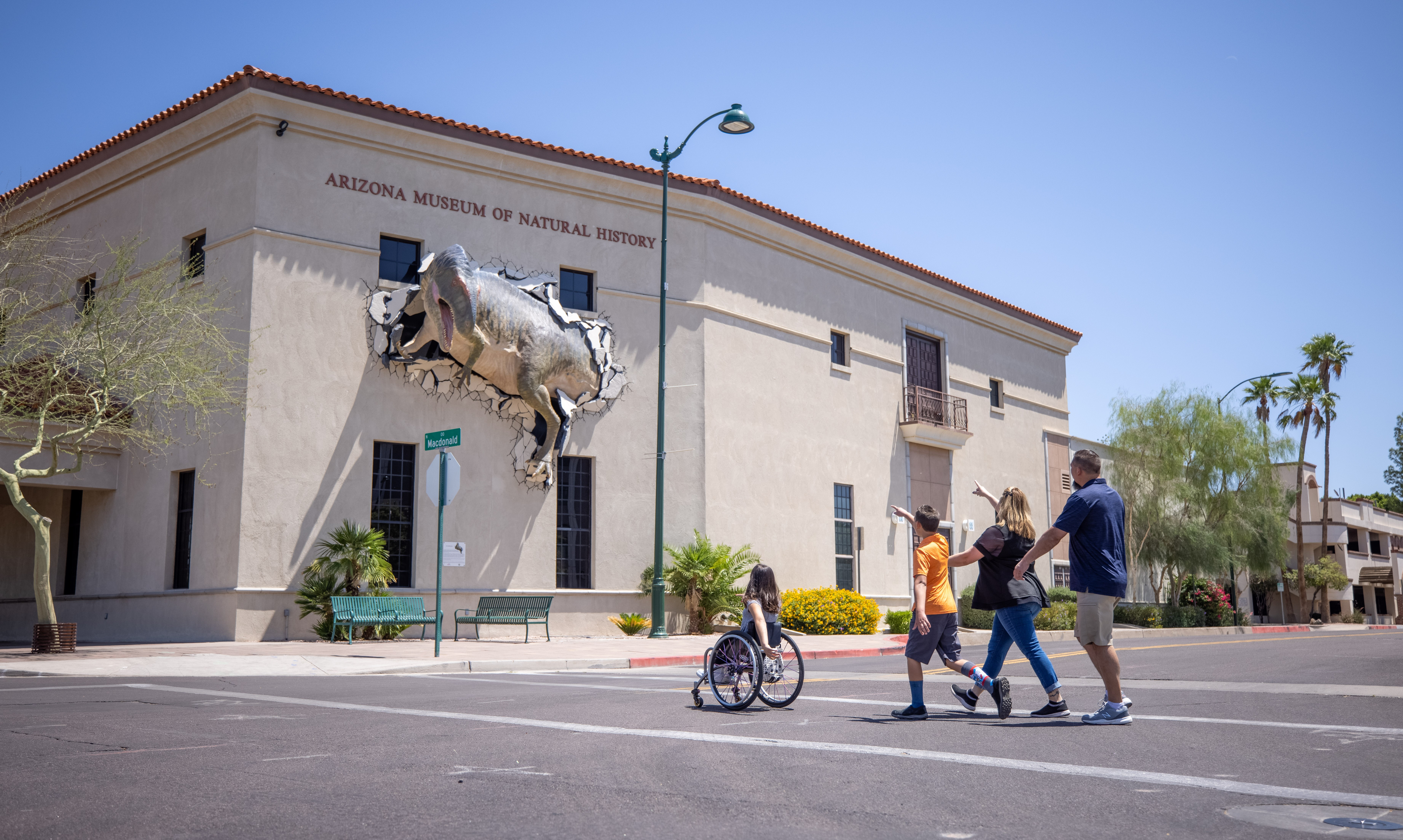 A family approaching the Arizona Museum of Natural History in Downtown Mesa